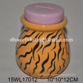 Colorful ceramic piggy bank with chain decorations